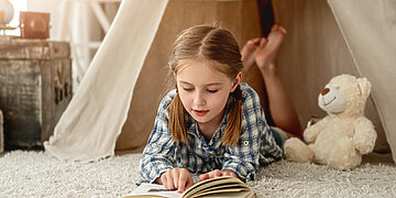 Kaip paskatinti vaiką skaityti knygas?